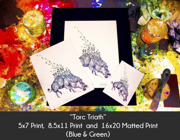 Photo of Torc Triath Boar Art products in 5x7 Print, 8.5x11 Print and 16x20 matted print on an etching inking station to display size differences in the blue and green color option only